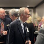 International Club of Annapolis President Phil Reynolds speaking with guests during the reception at the DoubleTree Hotel in Annapolis, Maryland.